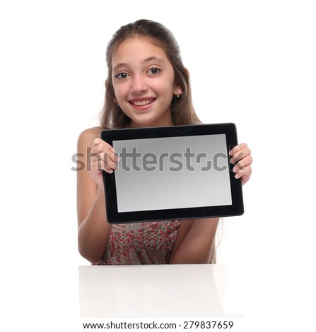 Beautiful pre-teen girl with a tablet computer. Isolated. Clipping path for the screen