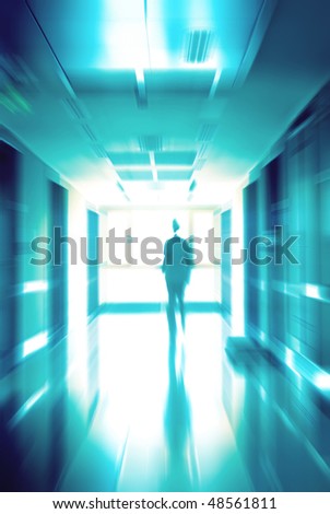 Doctor running at a hospital hall