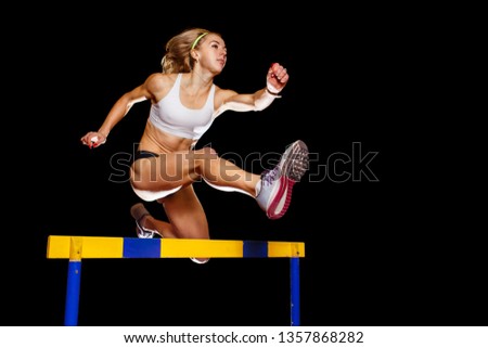 Similar – Image, Stock Photo Strong sportswoman jumping over sandy hill