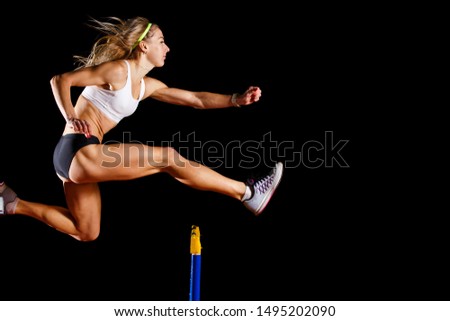 Image, Stock Photo Strong sportswoman jumping over sandy hill