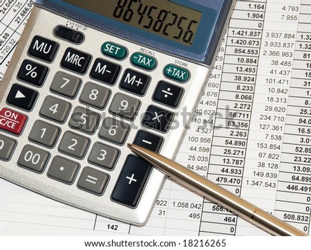 silver calculator with pen and calculations numbers on paper