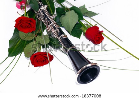 three red roses and clarinet composition over white