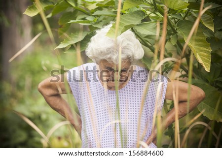 Very old caucasian woman relaxing in the garden