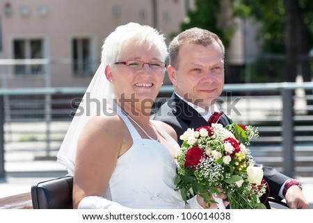 Bride and groom at the horse-drawn carriage ride