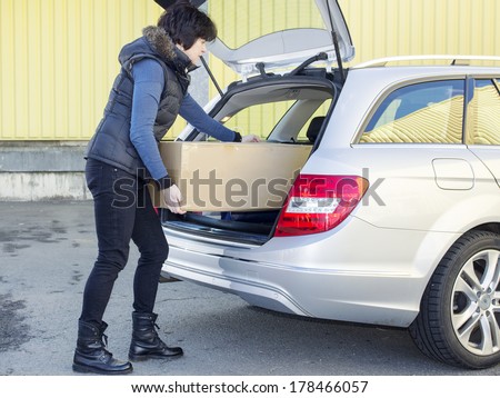 Woman Boots box in the trunk of the car