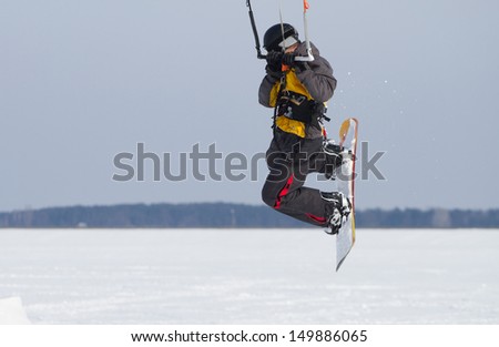 Snow kiting on a snowboard
