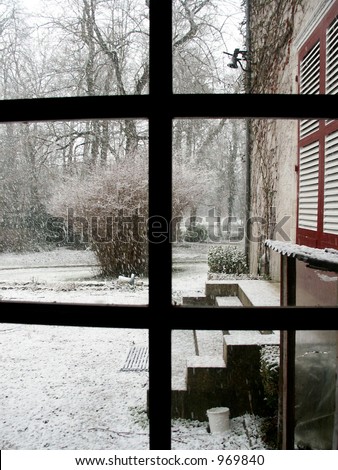 Snowfall at a Country House - Snowfall starts to covers the terrace and the outside dining bell.