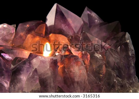 Amethyst Candlelight - Quartz crystal used in alternative medicine to alleviate stress and anxiety.