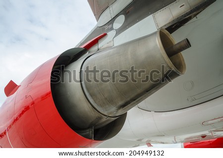 Close up of the underside of a jet airplanes turbine burner