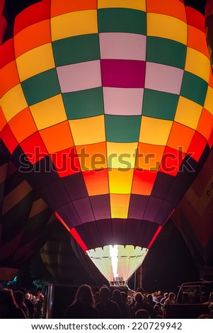 HIGH RIVER, ALBERTA, CANADA - SEPT. 26:  Colorful hot air balloons brightly lit during the \