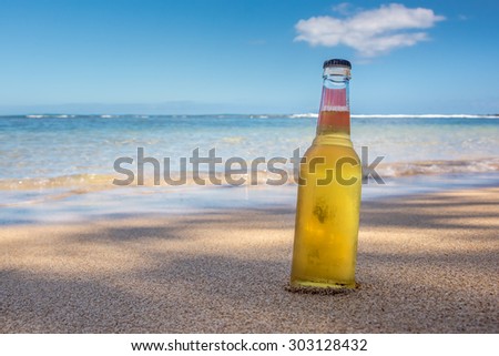 Cool refreshing alcoholic drink in the sand & shade next to the ocean