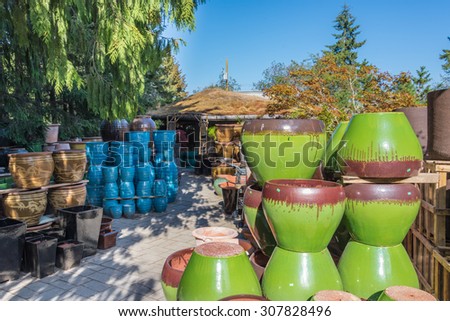 Colorful ceramic & terracotta planter pots in a market.