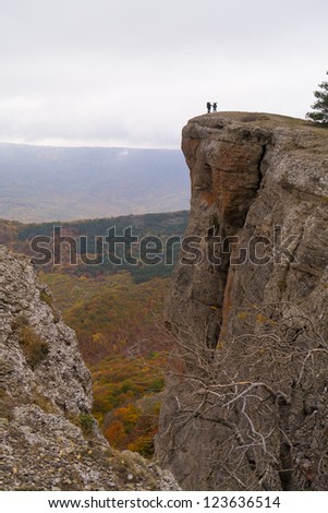 Two tourists on top of the cliff