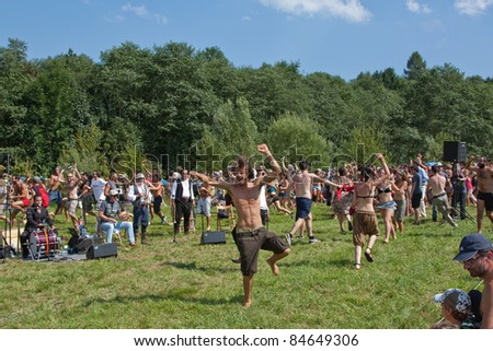 PIEVE TESINO, ITALY - AUGUST 19: Crowd dances on Goran Bregovic concert in Pieve Tesino during 