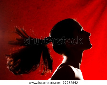 girl with black long hair in backlight