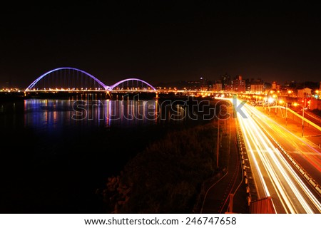 Night sight view, bridge with rainbow color light at night and car light
