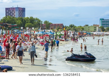 MAMAIA, ROMANIA - AUGUST 5: Crowded summer resort beach on August 05, 2011 in Mamaia, Romania. Mamaia is Romania\'s oldest, largest and best resort at Black Sea Coast.