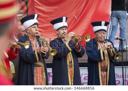 BUCHAREST, ROMANIA - MAY 17: Traditional Ottoman army band members performe at trumpets during the celebratory events Turkish Festival on May 17, 2013 in Bucharest, Romania.