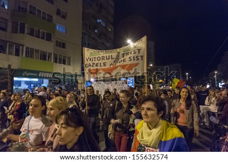 BUCHAREST, ROMANIA - SEPT 22: Unidentified people protest for the 22nd day against the plan to open Europe's largest open-cast goldmine in the Rosia Montana on Sept 22, 2013 in Bucharest, Romania.