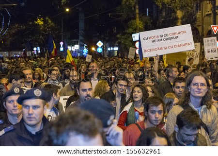BUCHAREST, ROMANIA - SEPT 22: People join the protests for the 22nd day against the plan to open Europe's largest open-cast goldmine in the Rosia Montana on Sept 22, 2013 in Bucharest, Romania.