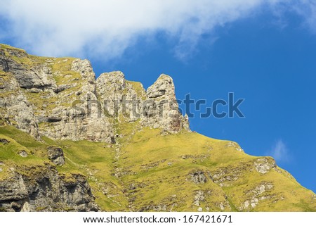 Daylight landscape with majestic rocky heights in Bucegi mountains, Romania