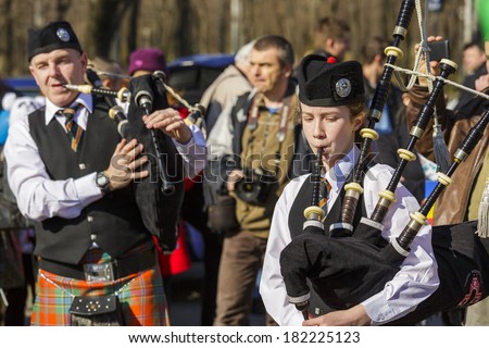 BUCHAREST - MARCH 16: Traditional Irish bagpipe band celebrate the 2nd edition of St. Patrick\'s Day Parade on March 16, 2014 in Bucharest, Romania.