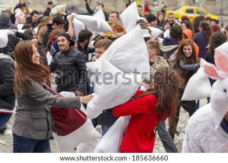 BUCHAREST, ROMANIA - APRIL 5: Large group of unidentified people gather and have fun at annual International Pillow Fight Day on April 5, 2014 in University Square, Bucharest, Romania.