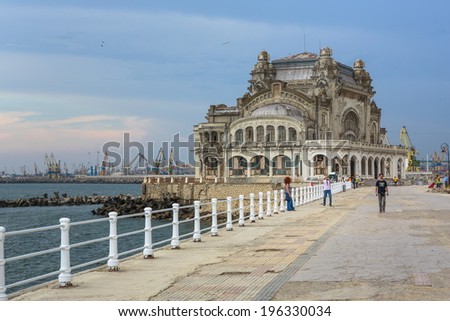 CONSTANTA, ROMANIA - MAY 27: Unidentified people stroll along the old Casino sea wall on May 27, 2014 in Constanta, Romania. Casino is one of the most representative symbols of the city.