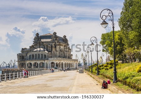 CONSTANTA, ROMANIA - MAY 27: Unidentified people enjoy a sunny day on old Casino sea wall on May 27, 2014 in Constanta, Romania. Casino is one of the most representative symbols of the city.