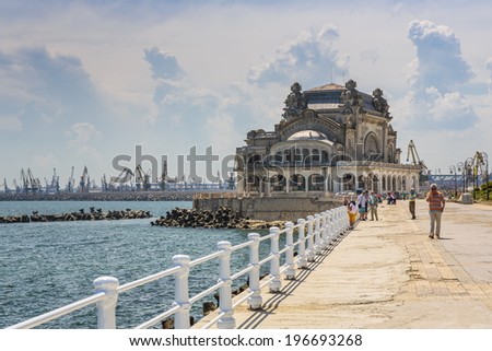 CONSTANTA, ROMANIA - MAY 27: Unidentified tourists enjoy the sights on old Casino sea wall on May 27, 2014 in Constanta, Romania. Casino is one of the most representative symbols of the city.