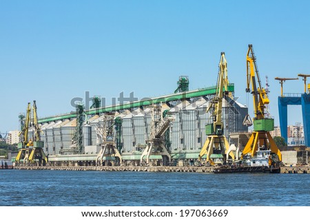 CONSTANTA, ROMANIA - MAY 25, 2014: Industrial port shipyard quay with heavy load gantry cranes and large containers in Constanta port, the largest on the Black Sea and the 18th largest in Europe.