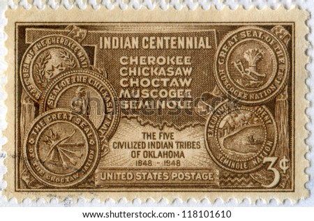 USA - CIRCA 1948: a stamp printed in the United States shows Map of Indian Territory and Seals of Five Civilized of Oklahoma Tribes. Indian centennial. Scott catalog A419, circa 1948