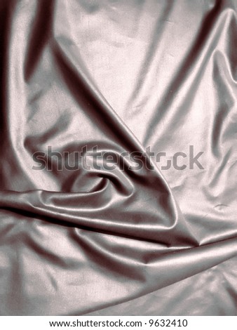 close up photo of a silver satin sheet