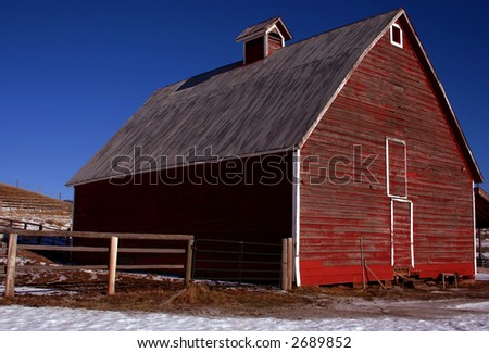 Rustic red Idaho barn in early winter