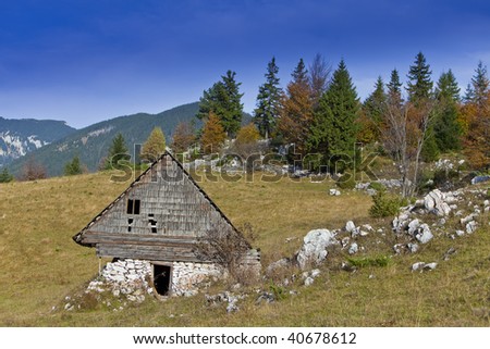 Lonely mountain cottage in autumn