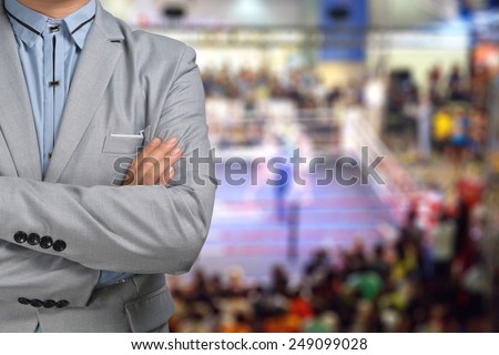Promoter or Manager of Boxing in suit with ring on the Background
