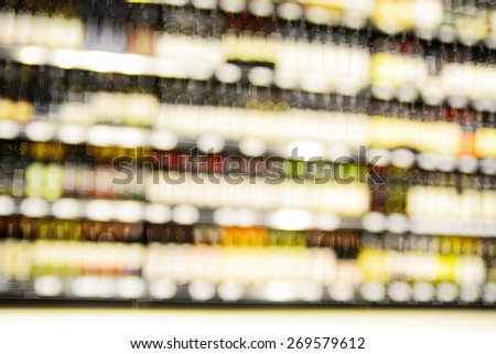 Blur or Defocus image of Wine on the Shelf of Liquor Store
