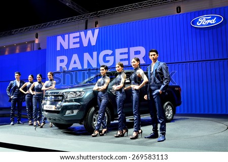 BANGKOK - March 26 : New Ford Ranger, Pick up truck, with male and Female presenters on DisPlay at 36th Bangkok International Motor Show on March 26, 2015 in Bangkok, Thailand.