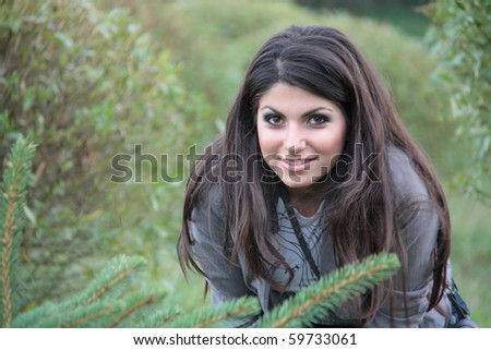 Portrait of the girl in bushes