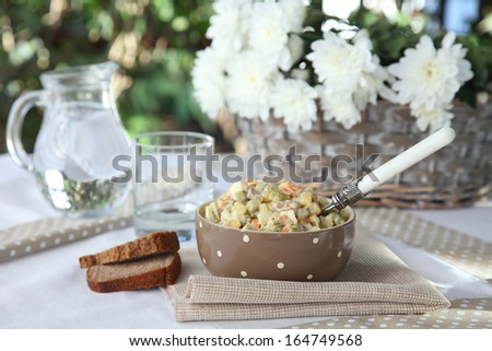 Russian salad on rye bread. Festive table setting. Olivier. Winter salad.