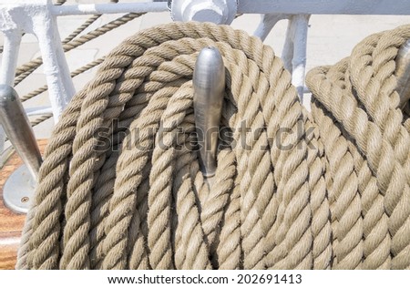 Reeled ship ropes hanging on the spools