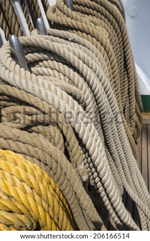 Reeled ship ropes hanging on the spools