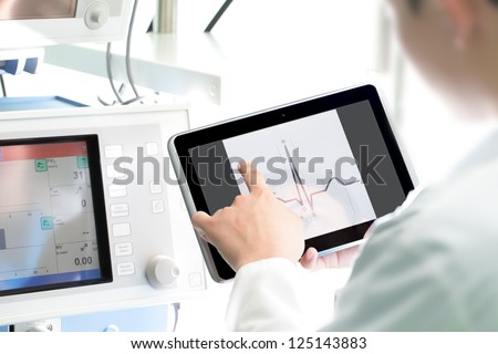 Doctor at work with a digital tablet