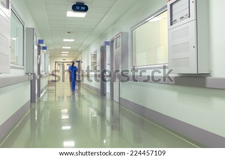 Hospital corridor with blurred figures of the medical staff