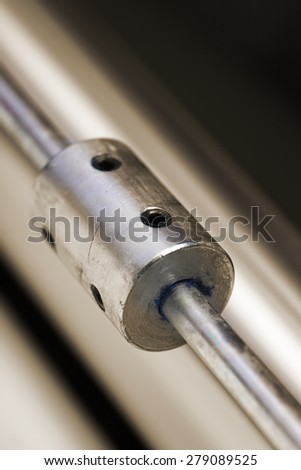 Metal rod with screw holes close-up