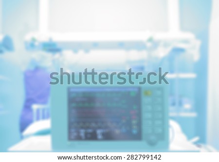 Medical background with a monitor in a hospital ward. Blurred healthcare background