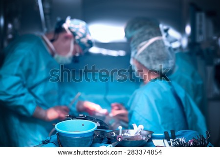 Teamwork of doctors in the operating room of the hospital