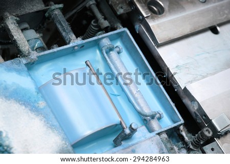 Container with the paint in the industry
