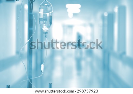 Medical drip on the background of blurred hospital corridor