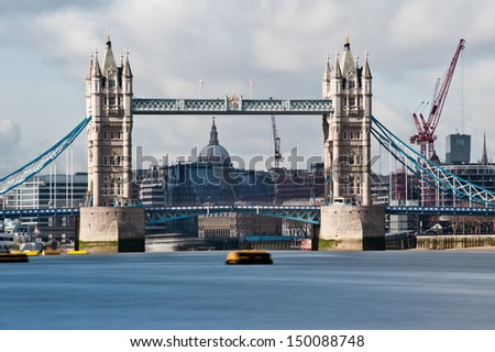 Tower Bridge in London. The long exposure creates a beautiful effect on the waters of the river Thames and the clouds passing over the city.